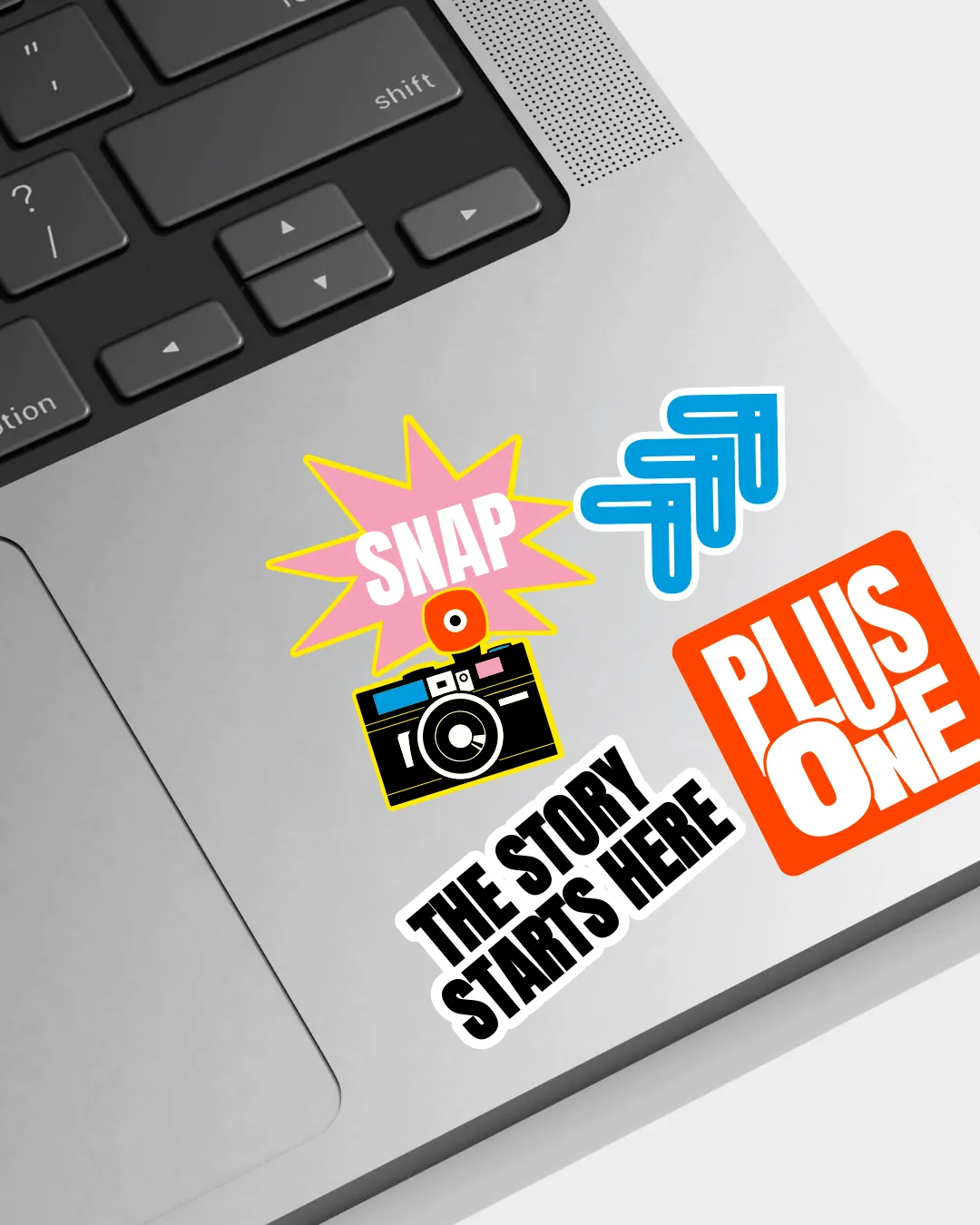 Plus One stickers on a laptop